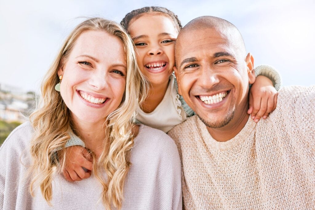 10 Facts on How Often You Should See a Dentist 3 mom-dad-and-girl-smiling